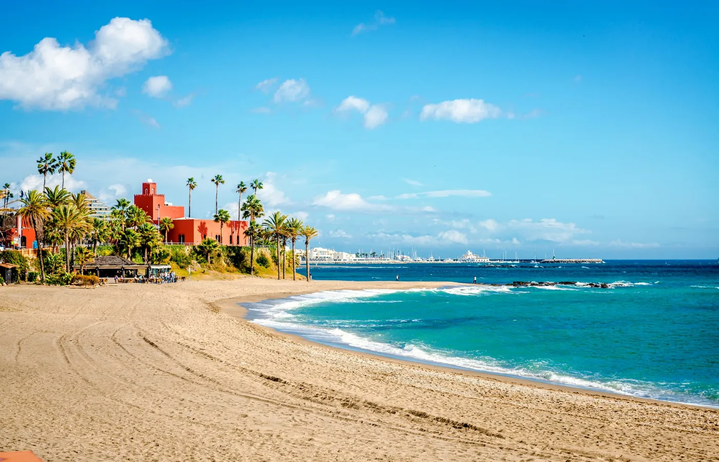 Benalmádena beach with the iconic red Bil Bil castle and palm-lined promenade