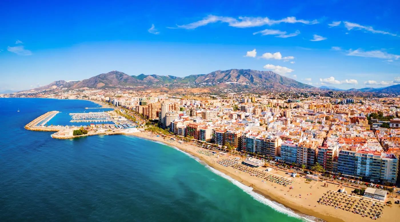 Aerial view of Fuengirola beach, marina and the Mijas mountains