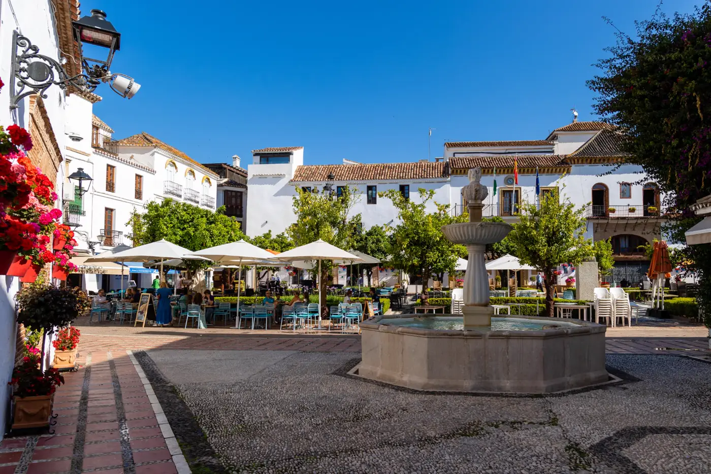 Fountain and outdoor cafés in Marbella old town's Plaza de los Naranjos