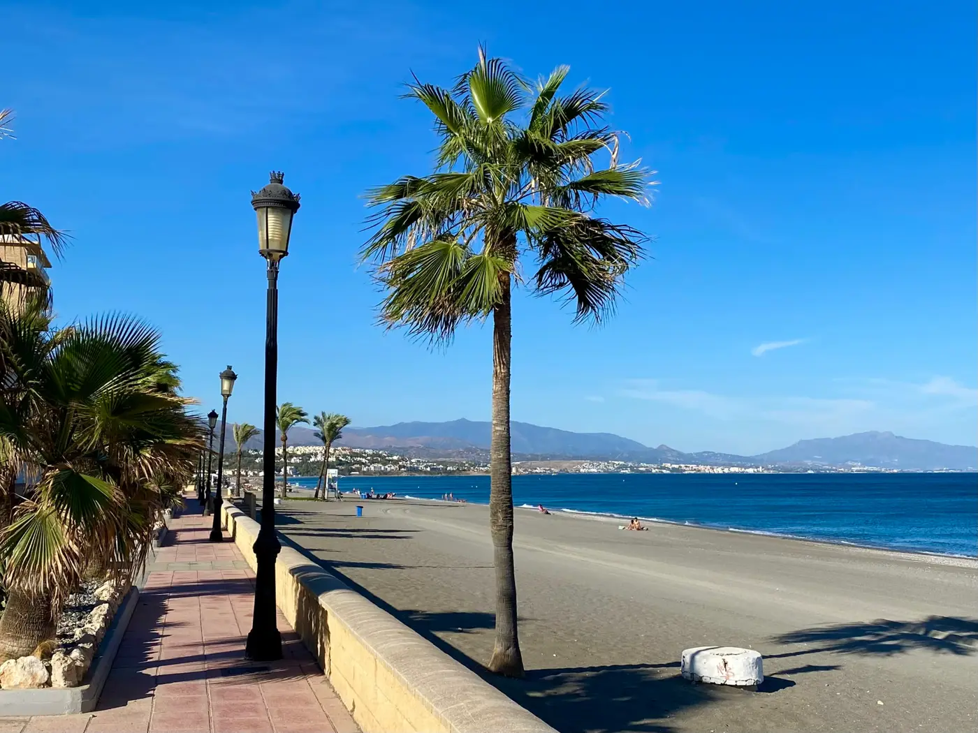 Sabinillas beach and palm-lined seafront promenade
