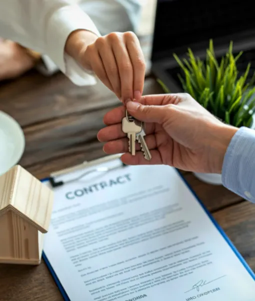 A set of house keys held securely on behalf of a property owner